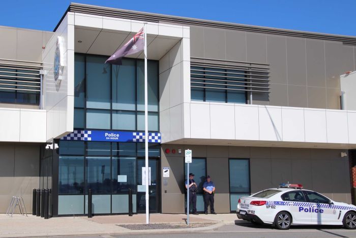 A police station/office along with the australian flag and a police car, which is header image of the blog entitled "safewa police data access".