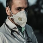 A doctor wearing mask, from the blog post "client-lawyer costs during covid-19".