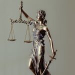 Small lady justice figure as the featured image of "perth post covid lockdown and court's respond" blog.
