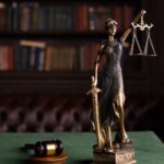 Close-up of the Lady Justice miniature which represents the "permanent stay of proceedings" blog.